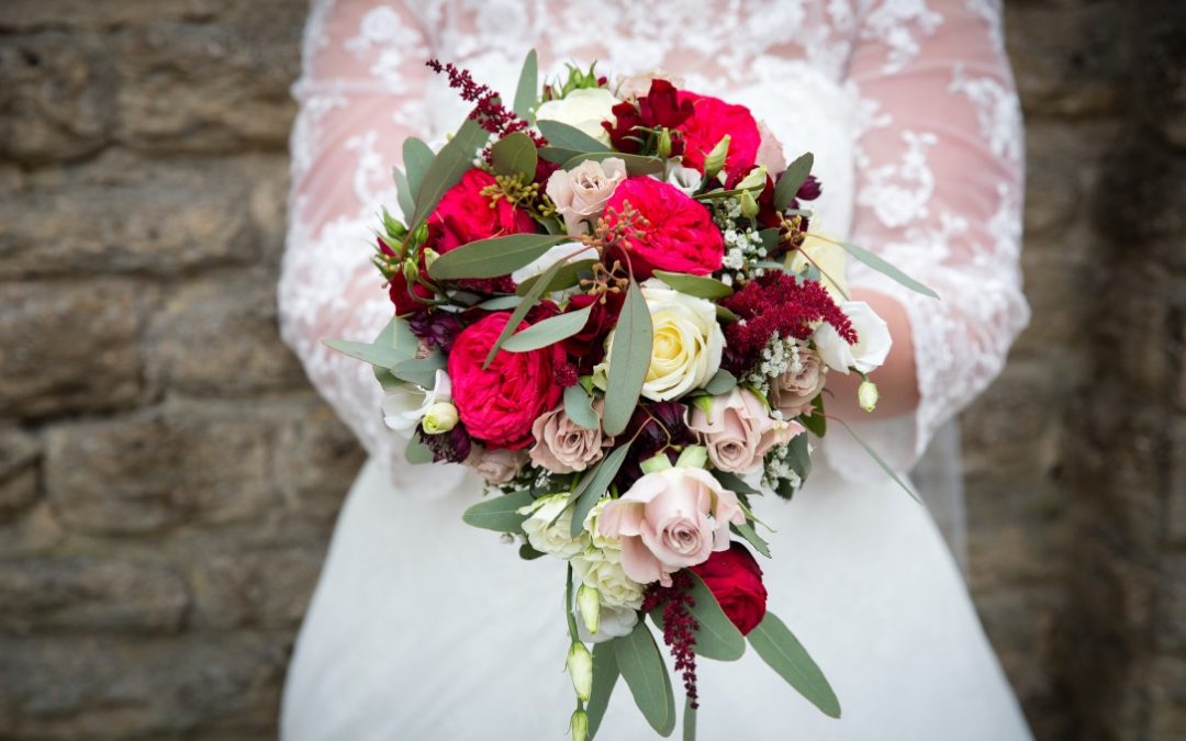 Red, pink and white autumn and winter wedding bouquet