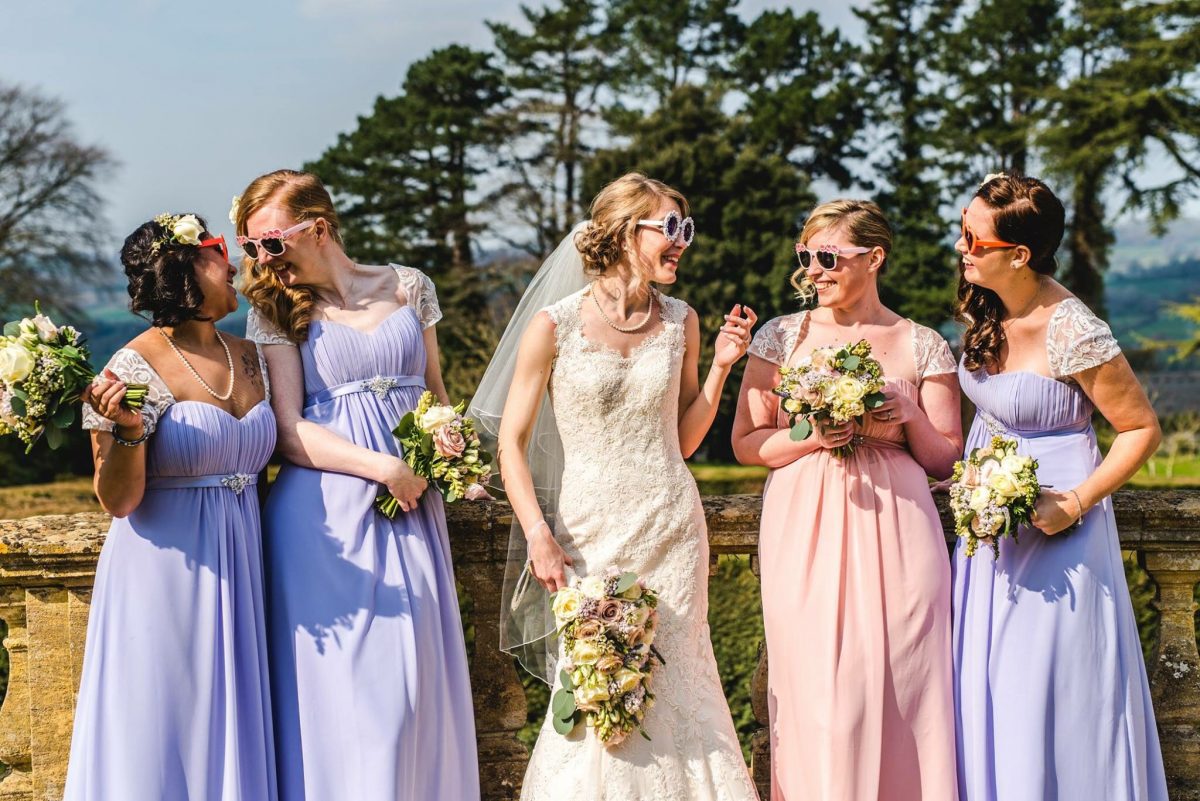 Bride and bridesmaids wearing sunglasses Coombe Lodge near Bristol