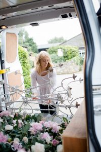 wedding florist loading flowers into van