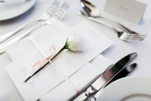 wedding place setting decorated with a single flower