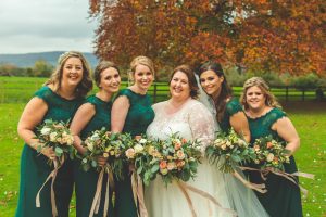 daisy lane floral design eastington park wedding flowers bride with bridesmaids in emerald green dresses