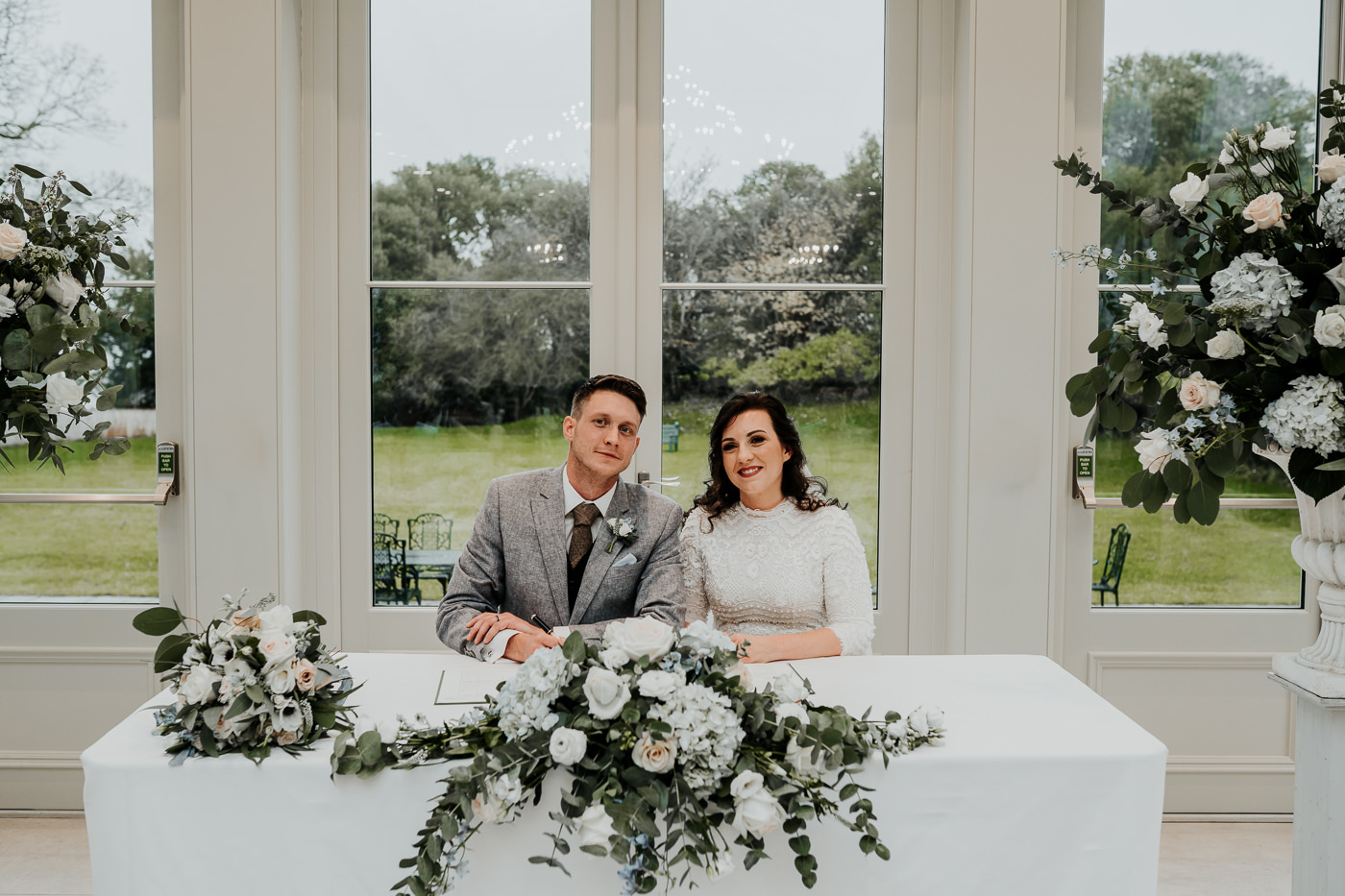 Wedding ceremony flowers the orangery at Clevedon Hall