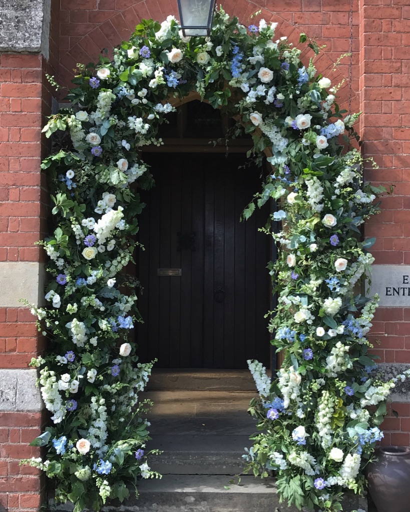 Floral arch at entrance to church