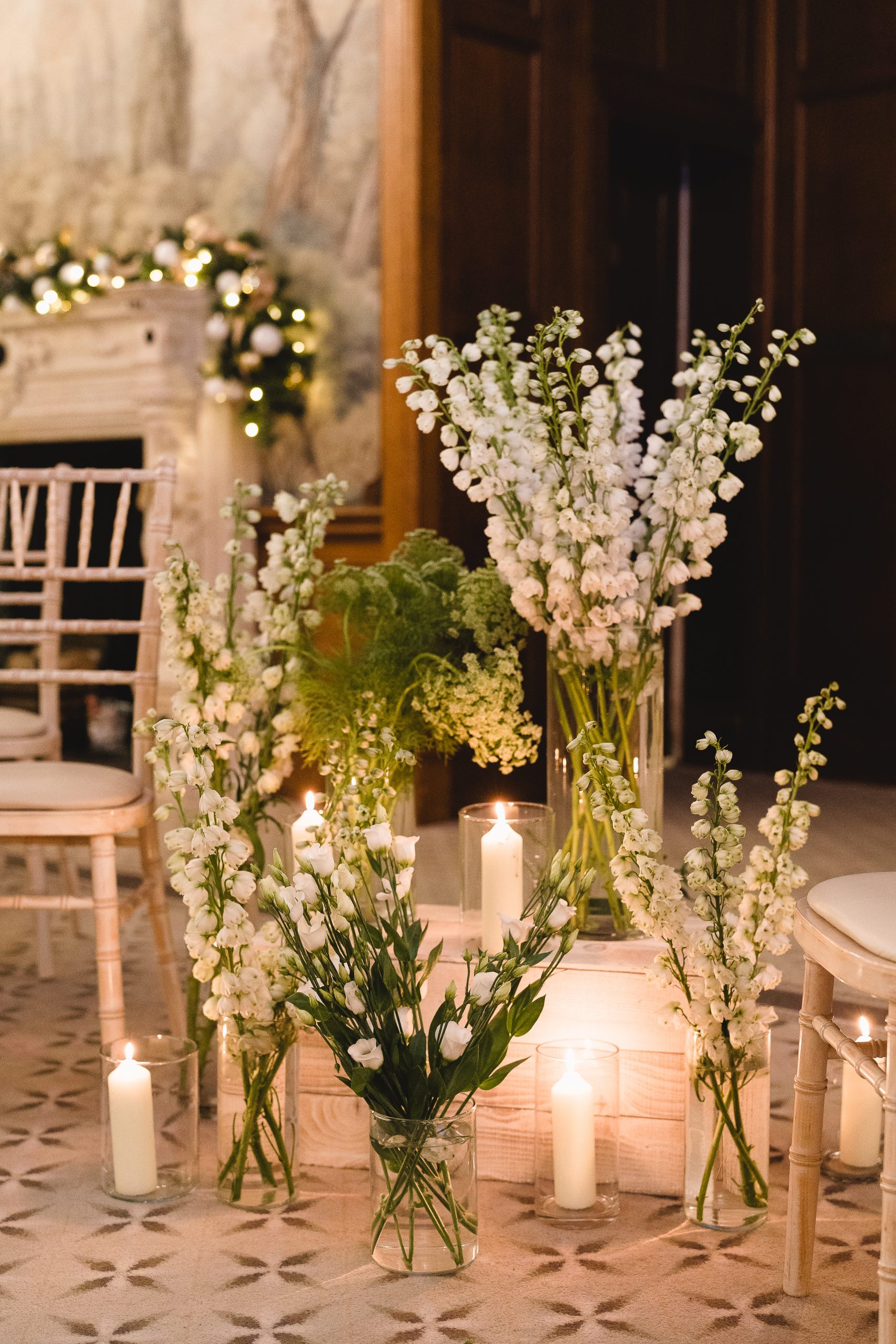 Candles and flowers decorating aisle at wedding ceremony