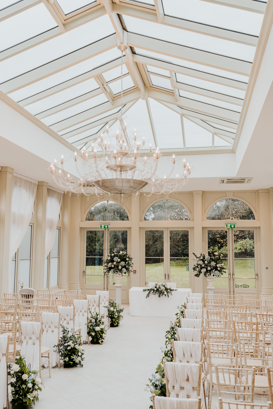 meadow arrangements decorating aisle at wedding ceremony