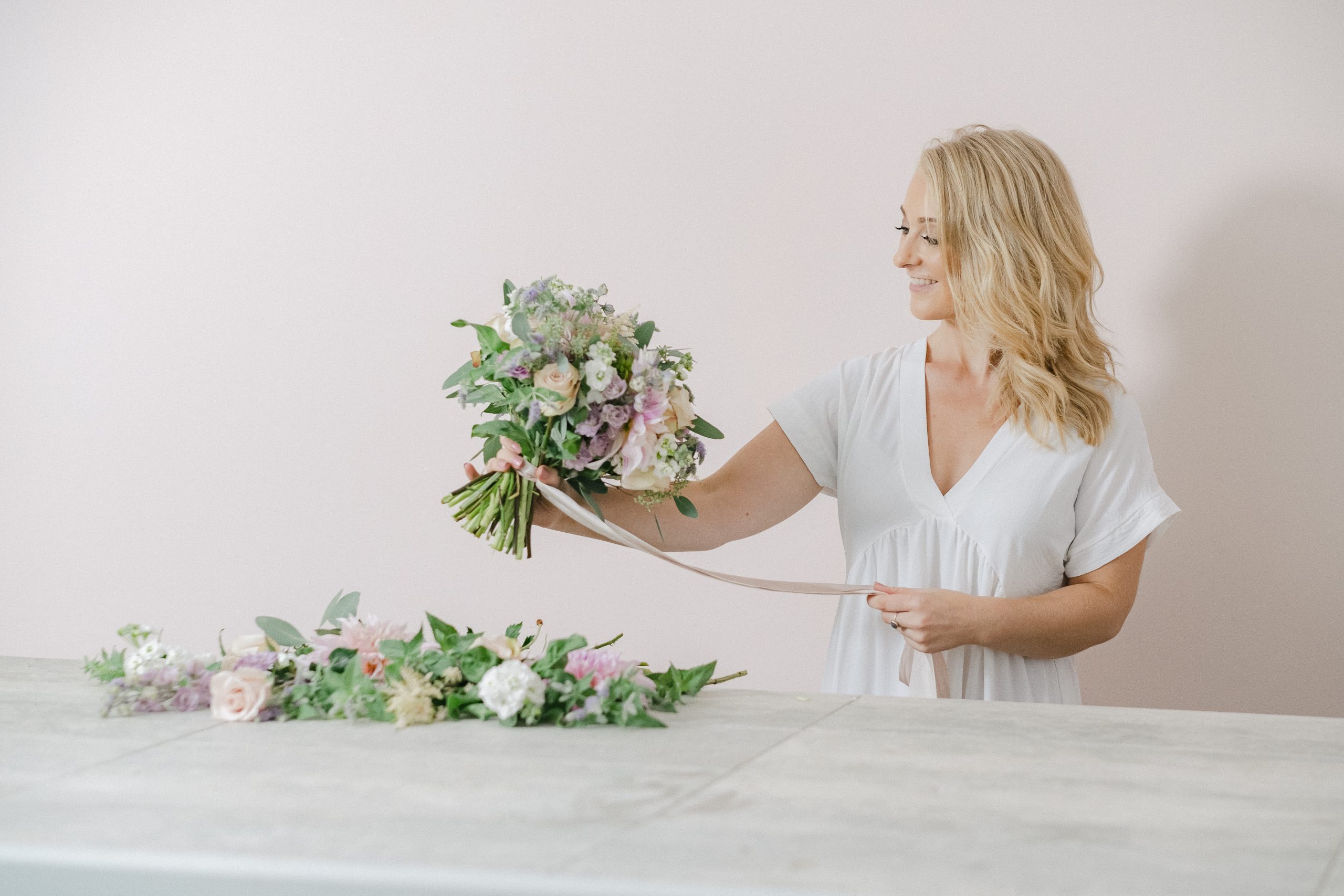 florist making bouquet